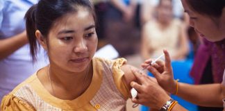 Woman receiving a vaccine at the Mother and Child Hospital in Vientiane, Laos