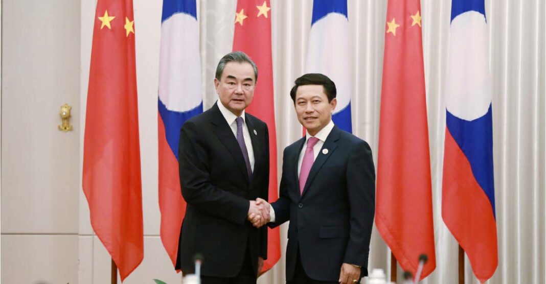 China's Foreign Minister Wang meets with Minister of Foreign Affairs Saleumxay Kommasith