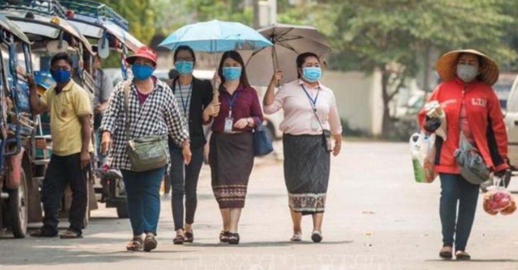 Lao People in Face Masks to Prevent Covid-19 in Laos