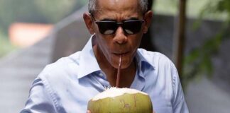 Obama drinks coconut water in Luang Prabang