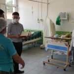 Vietnamese doctors work in a Lao hospital
