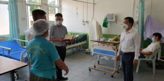 Vietnamese doctors work in a Lao hospital