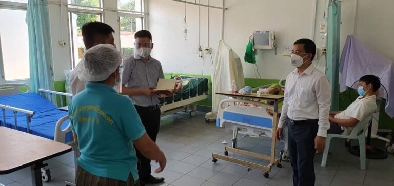 Vietnamese doctors work in a Lao hospital