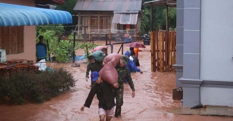 Military personnel assist villagers in flooded Luang Namtha