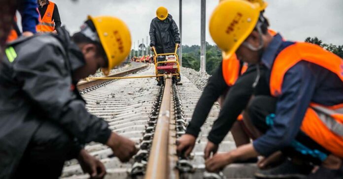 Chinese engineers working on tracks for the Laos-China Railway