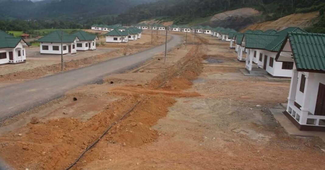 A handover ceremony for new houses provided to relocated villagers.