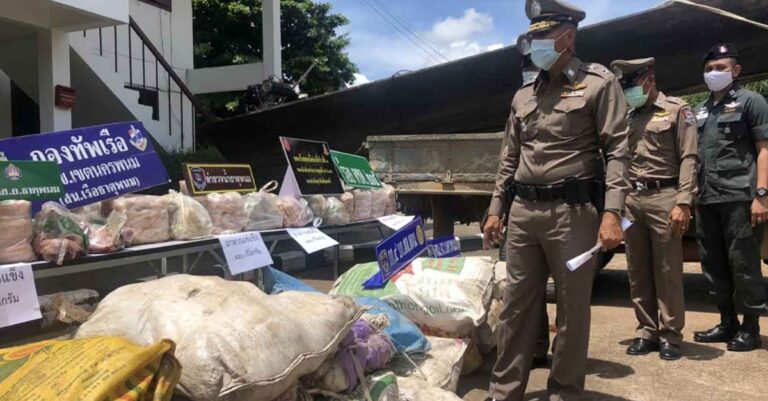 Thai police officers sieze smuggled goods