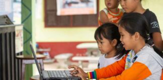 Children in Laos use remote learning systems