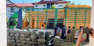 Truck carrying empty beer bottles filled with illicit drugs