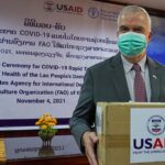 US Ambassador Peter Haymond presents donated testing kits