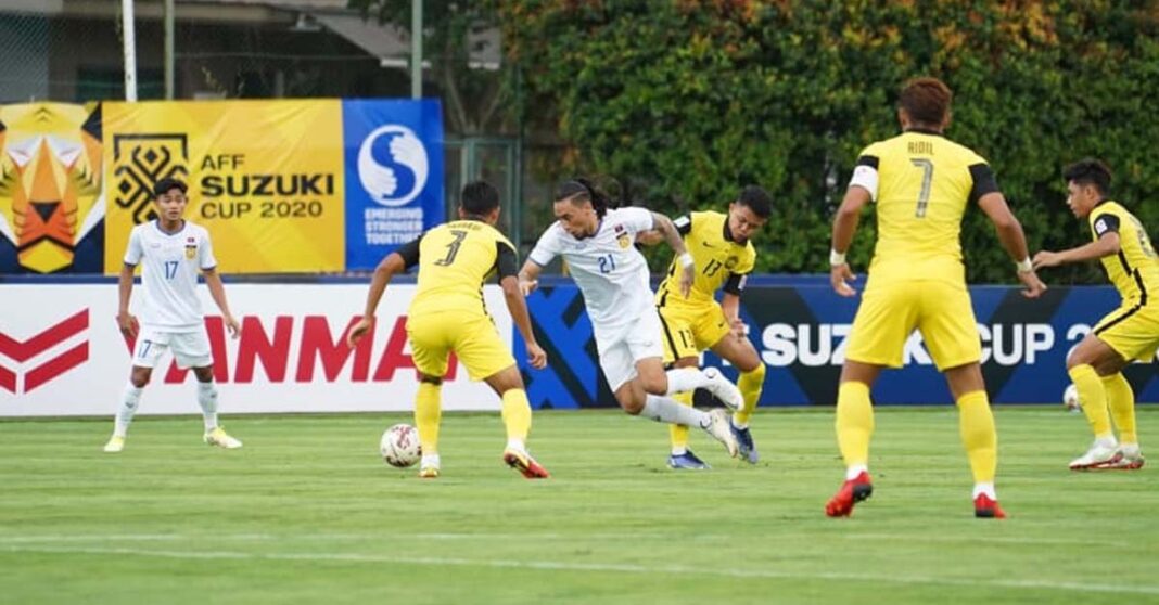 Laos striker Billy Ketkeophomphone in action during the Group B match against Malaysia.