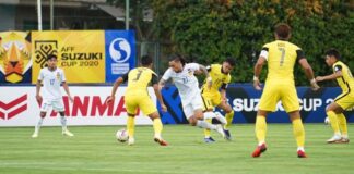 Laos striker Billy Ketkeophomphone in action during the Group B match against Malaysia.