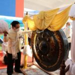 Prime Minister Phankam Viphavanh Strikes the Gong Nine Times