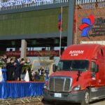 The first freight trucks make deliveries from the Vientiane Logistics Park