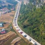 A long queue of freight trucks.