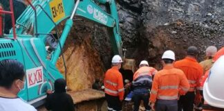 Rescue workers from Lane Xang Minerals help save trapped illegal miners