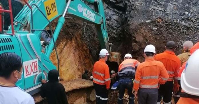 Rescue workers from Lane Xang Minerals help save trapped illegal miners