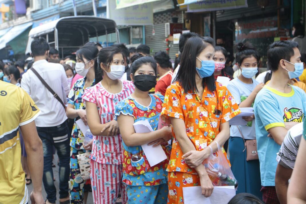 Migrant workers in Thailand queue up for Covid-19 testing at an apartment in Samut Sakhon (Photo: Bangkok Post)