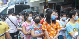 Migrant workers in Thailand queue up for Covid-19 testing at an apartment in Samut Sakhon (Photo: Bangkok Post)