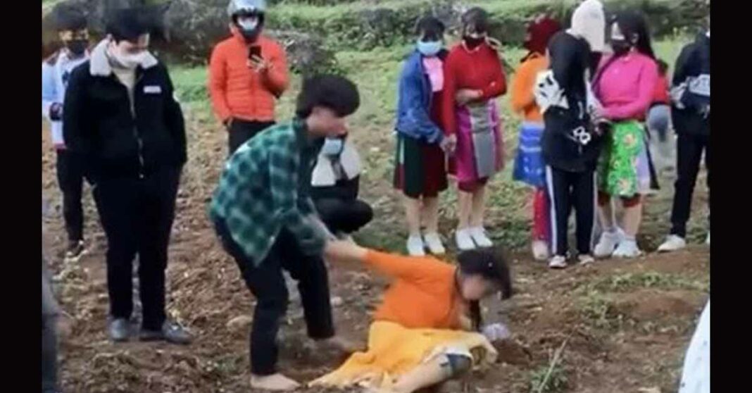 A still image from a video shared on social media shows an 18-year-old man trying to make a 16-year-old girl his wife in Ha Giang Province, February 2022.