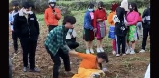 A still image from a video shared on social media shows an 18-year-old man trying to make a 16-year-old girl his wife in Ha Giang Province, February 2022.