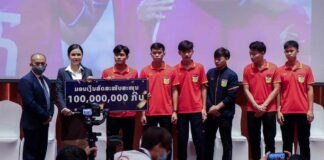 Phijika Boonkwang makes donation to Laos football team.