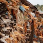Plastic trapped in an abandoned structure on the Mekong River, Laos. Photo: Xaisongkham Induangchanthy/World Bank