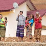 Resettled villagers in front of their new homes in Buam Or Village Luang Prabang