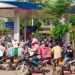 Motorbikes queue for petrol during the ongoing fuel crisis in Laos