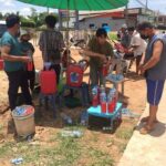 Motorists buy petrol in plastic bottles from roadside resellers.