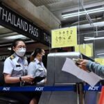 Airport staff checking a passenger’s documents (Photo: New Strait Times)