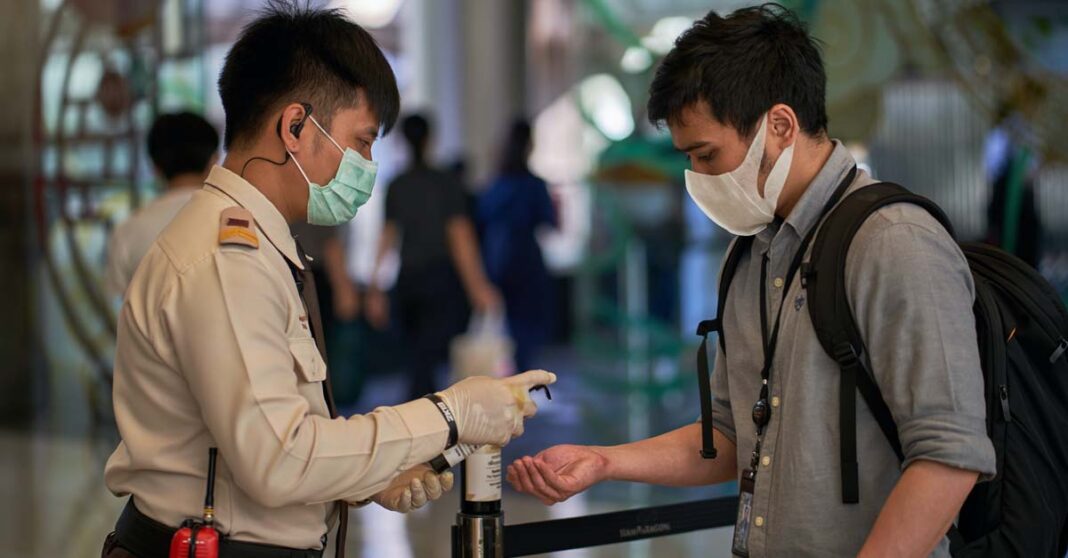 Covid-19 disinfection procedure in Thailand (Photo by Norbert Braun on Unsplash)