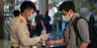 Covid-19 disinfection procedure in Thailand (Photo by Norbert Braun on Unsplash)