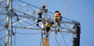 Electricity workers in Cambodia