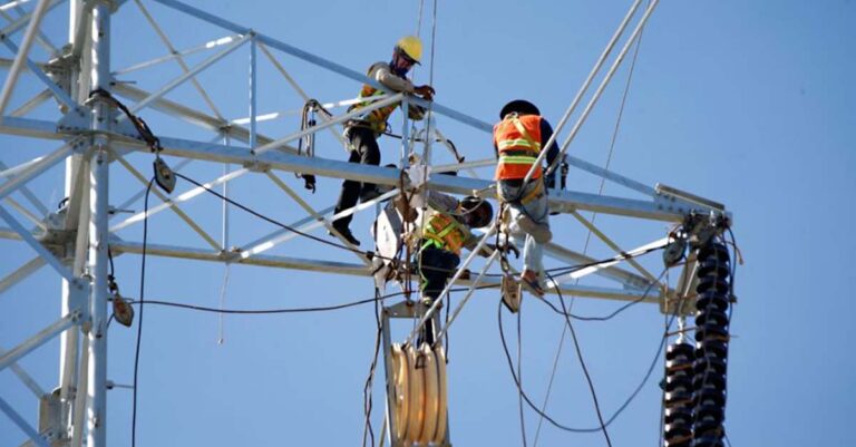 Electricity workers in Cambodia