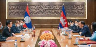 Foreign minister Prak Sokhonn (second right) and his Lao counterpart Saleumxay Kommasith (second left) at a meeting in February (Cambodia Ministry of Foreign Affairs and Internal Cooperation)