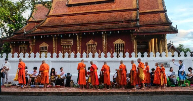 Locals and tourists alike participate in the morning almsgiving ceremony in Luang Prabang (Evensong Film)