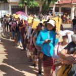 People in Laos line up to lodge passport applications at the consular department in Vientiane Capital