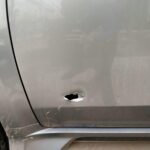 A bullet hole in a nearby car as a result of the exchange with police.