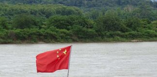 Chinese Flag on Barge along Mekong River