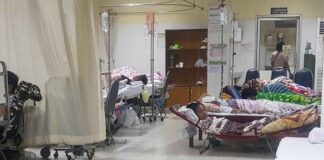 Dengue patients sleep in makeshift beds at Vientiane's Mahosot hospital during an outbreak in 2019.