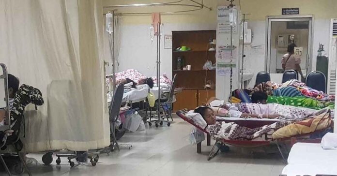 Dengue patients sleep in makeshift beds at Vientiane's Mahosot hospital during an outbreak in 2019.
