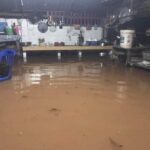 Floodwaters inundate the kitchen in a Vientiane home
