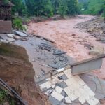 Houses swept away by floods and landslides in Xayaboury Province yesterday.