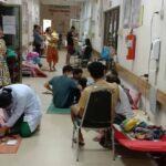 Patients at a children’s hospital treated in a hallway after beds fill up during the dengue fever outbreak (Djoy Vatthanaphone).