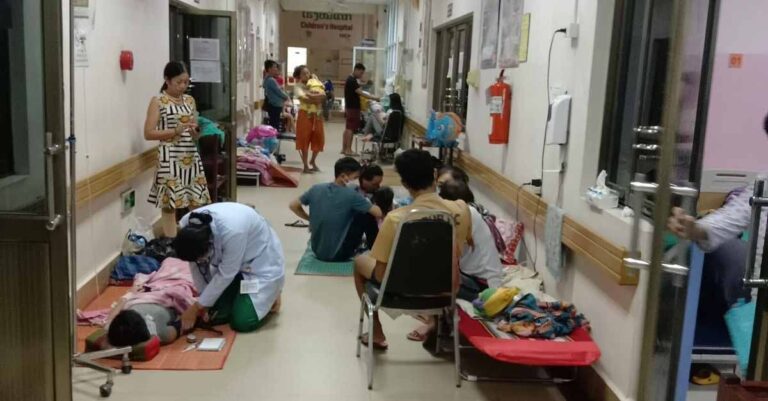 Patients at a children's hospital treated in a hallway after beds fill up during the dengue fever outbreak (Djoy Vatthanaphone).