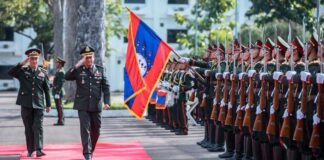 Lieutenant General Hun Manet and Khamliang Outhakaysone, Deputy Minister of National Defence and Chief of the General Staff of the Lao People’s Army, salute honour guards in Vientiane Capital on 30 August (HUN MANET VIA FACEBOOK).