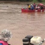 Rescue personnel search for the singer’s body in the Mekong River.