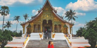 Tourists visit royal palace national museum in Luang Prabang