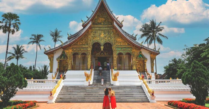 Tourists visit royal palace national museum in Luang Prabang
